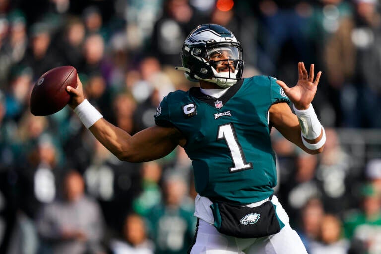 Philadelphia Eagles' Jalen Hurts looks to pass during the first half of an NFL football game against the Tennessee Titans, Sunday, Dec. 4, 2022, in Philadelphia