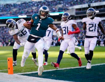 Philadelphia Eagles' Jalen Hurts scores a touchdown during the first half of an NFL football game against the Tennessee Titans, Sunday, Dec. 4, 2022, in Philadelphia. (AP Photo/Matt Rourke)