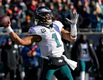 Philadelphia Eagles' Jalen Hurts passes during the first half of an NFL football game against the Chicago Bears, Sunday, Dec. 18, 2022, in Chicago. (AP Photo/Nam Y. Huh)