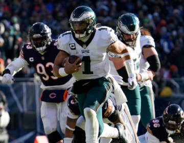 Philadelphia Eagles' Jalen Hurts runs for a touchdown during the first half of an NFL football game against the Chicago Bears, Sunday, Dec. 18, 2022, in Chicago. (AP Photo/Nam Y. Huh)