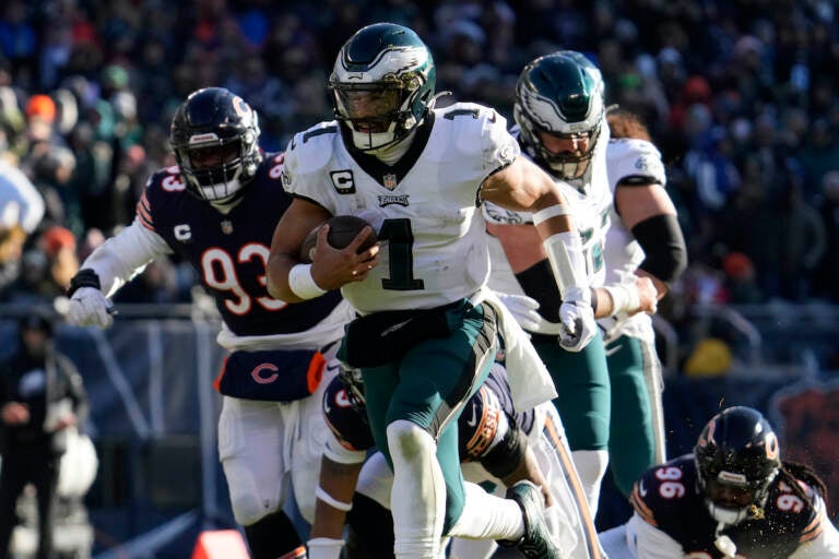 Philadelphia Eagles' Jalen Hurts runs for a touchdown during the first half of an NFL football game against the Chicago Bears, Sunday, Dec. 18, 2022, in Chicago. (AP Photo/Nam Y. Huh)