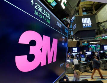 File photo: The logo for chemical and consumer products maker 3M appears on a screen above the trading floor of the New York Stock Exchange on Oct. 24, 2017. The company said Tuesday, Dec. 20, 2022, that it will phase out manufacturing of “forever chemicals” and try to get them out of all their products by the end of 2025. (AP Photo/Richard Drew, File)