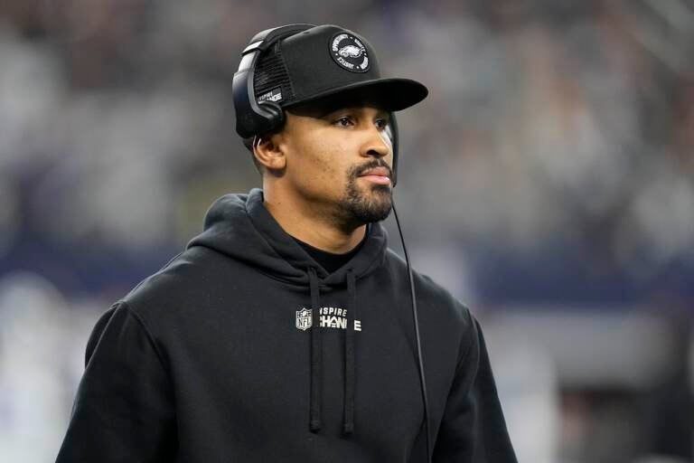 Philadelphia Eagles' Jalen Hurts is seen on the sideline during the second half of an NFL football game against the Dallas Cowboys Saturday, Dec. 24, 2022, in Arlington, Texas. (AP Photo/Tony Gutierrez)