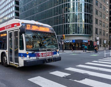 A SEPTa bus in the foreground with buildings in the background in Center City.