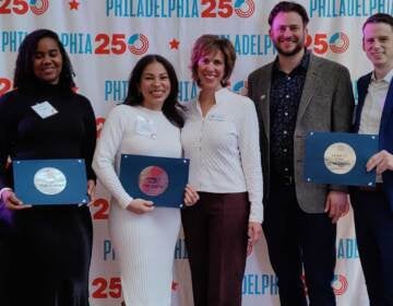 Danielle Smith of Smith Memorial Playground, artist Michelle Angela Ortiz of Our Market, and Chase Trimmer and Nate Garland of Pennsylvania Special Olympics. (Peter Crimmins /WHYY)