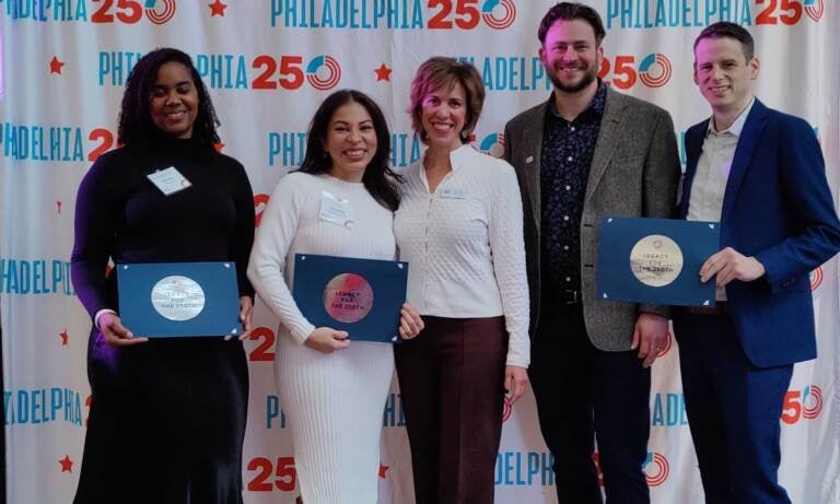 Danielle Smith of Smith Memorial Playground, artist Michelle Angela Ortiz of Our Market, and Chase Trimmer and Nate Garland of Pennsylvania Special Olympics. (Peter Crimmins /WHYY)