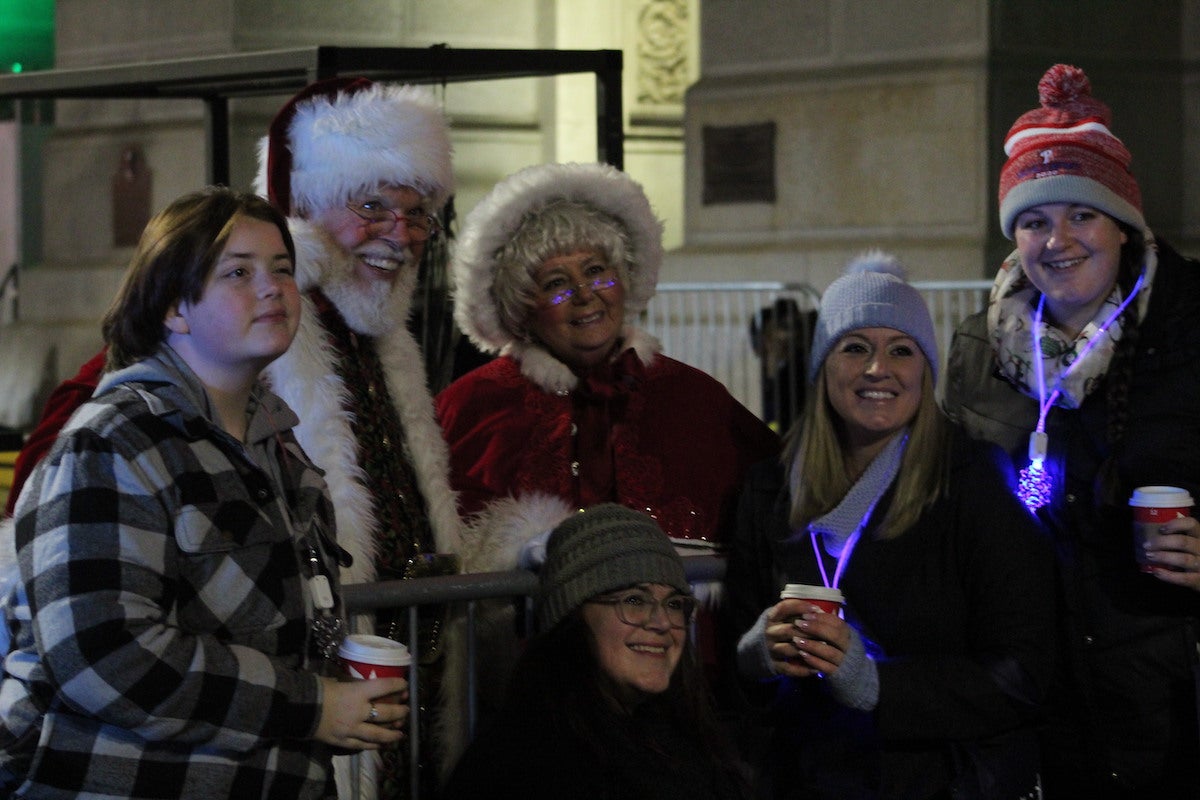 Mr. and Mrs. Claus made an early trip from the North Pole to Philly for the occasion. Still no word on who will get coal in their stocking this season. (Cory Sharber/WHYY)