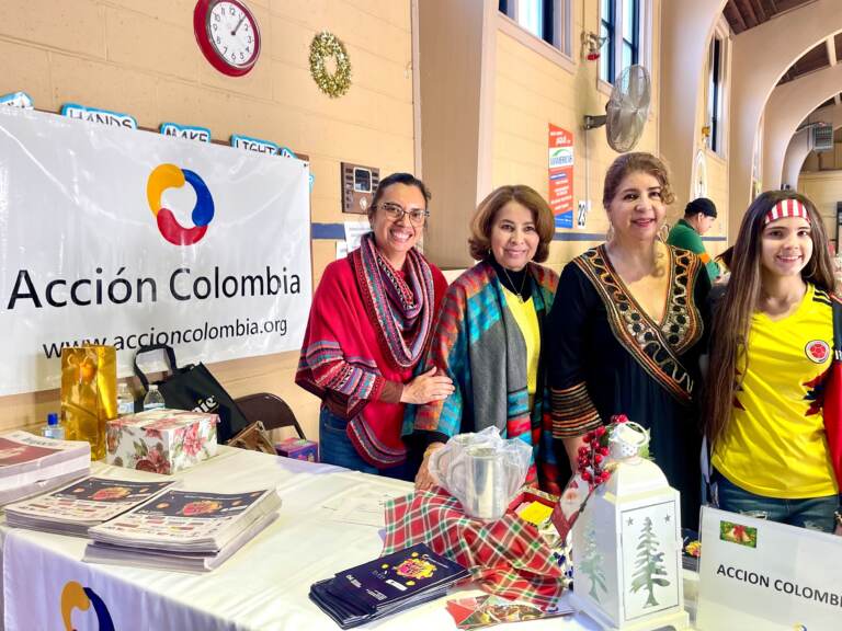 Executive Director of Accion Colombia, Leity Rodriguez-Largo (second from right), alongside her colleagues and volunteers of Sal y Dulce. (Johnny Perez-Gonzalez/WHYY)