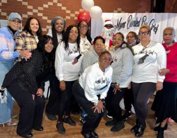 Moms Bonded by Grief's founder (fourth from right) with the moms who attended the organization's holiday party