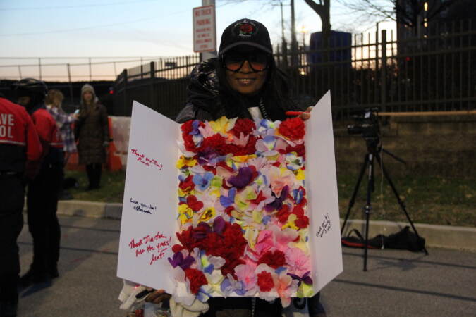 Roughly a dozen people arrived in a Target parking lot across from the 6abc Action News Studio on Dec. 21, 2022 for a tailgate honoring Jim Gardner's last show on the desk. (Cory Sharber/WHYY)