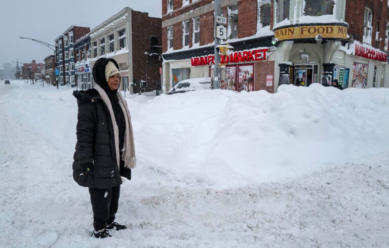 Kala Smith of Buffalo, N.Y., heads for a food store Monday on Main Street, not far from where she lives, after a massive snowstorm blanketed the city. (Craig Ruttle/AP)