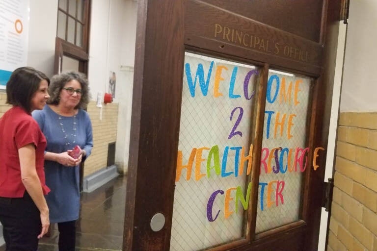 Pennsylvania health officials tour the school-based health center at Building 21 Lab School, a small district high school in North Philadelphia, on Thurs., Dec. 8, 2022. (Nicole Leonard/WHYY)