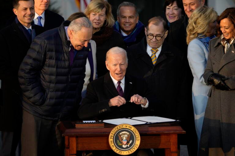 President Joe Biden signs the Respect for Marriage Act, Tuesday, Dec. 13, 2022, on the South Lawn of the White House in Washington. (AP Photo/Andrew Harnik)