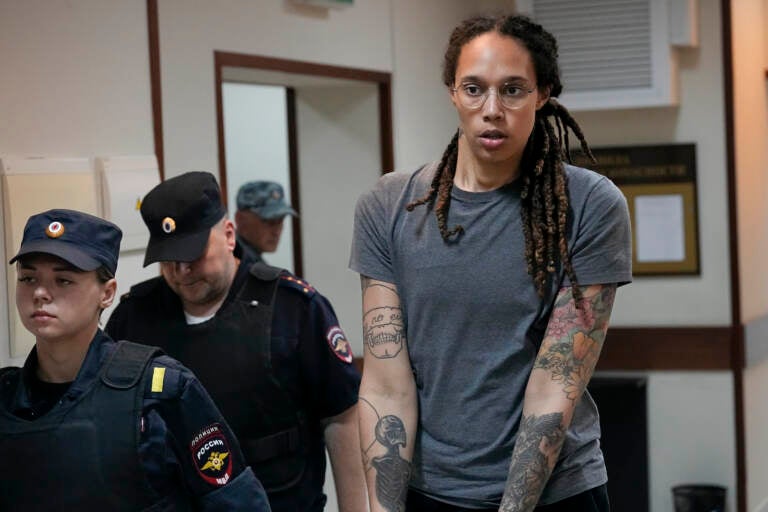 Brittney Griner is escorted from a courtroom