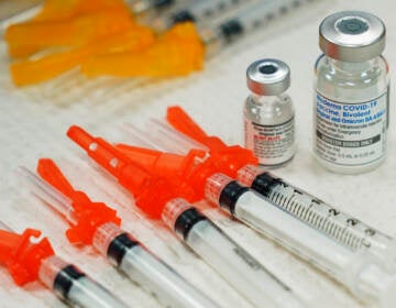 OVID-19 vaccines are readied for use at a clinic