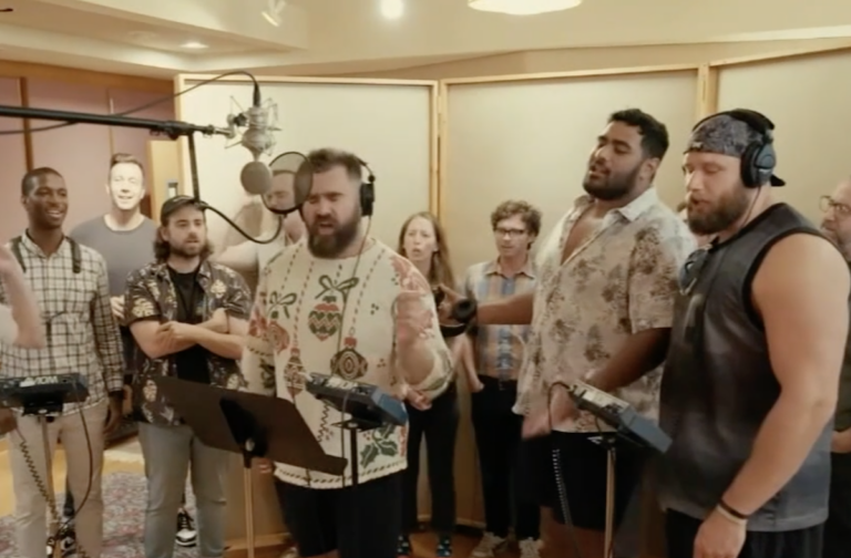 Eagles players in the studio singing
