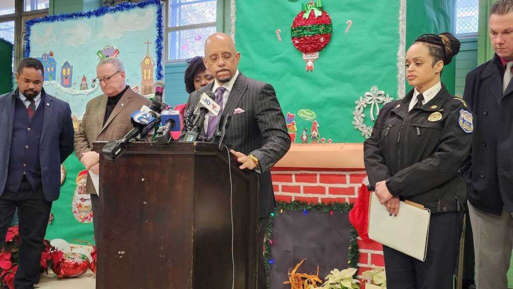 State Senator Vincent Hughes stands at a podium.