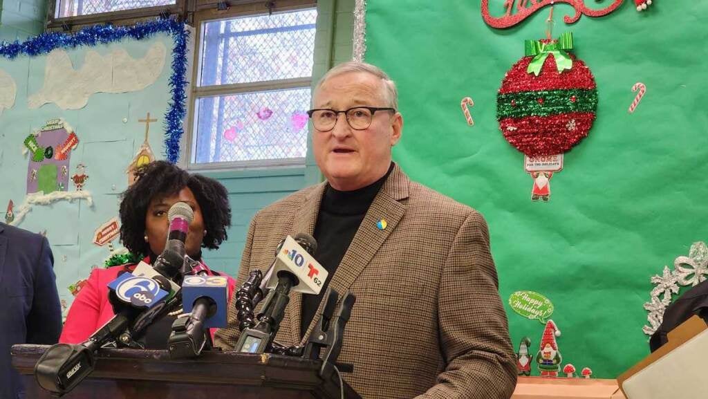 Mayor Jim Kenney speaks from a podium.