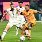 USA defender Walker Zimmerman (#3) fights for the ball with Netherlands' forward Memphis Depay during the 2022 World Cup round of 16 match at Khalifa International Stadium in Al Rayyan, Qatar on December 3, 2022. (Jewel Samad/AFP via Getty Images)