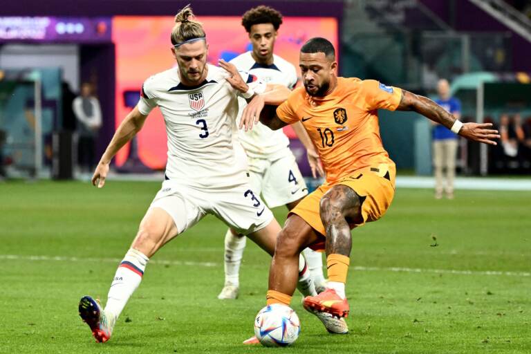 USA defender Walker Zimmerman (#3) fights for the ball with Netherlands' forward Memphis Depay during the 2022 World Cup round of 16 match at Khalifa International Stadium in Al Rayyan, Qatar on December 3, 2022. (Jewel Samad/AFP via Getty Images)