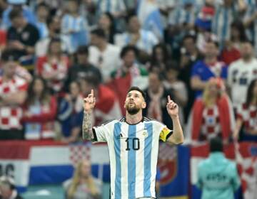 Argentina forward Lionel Messi celebrates scoring his team's first goal from the penalty spot during the World Cup semifinal match between Argentina and Croatia in Qatar on December 13, 2022. (Juan Mabromata/AFP via Getty Images)