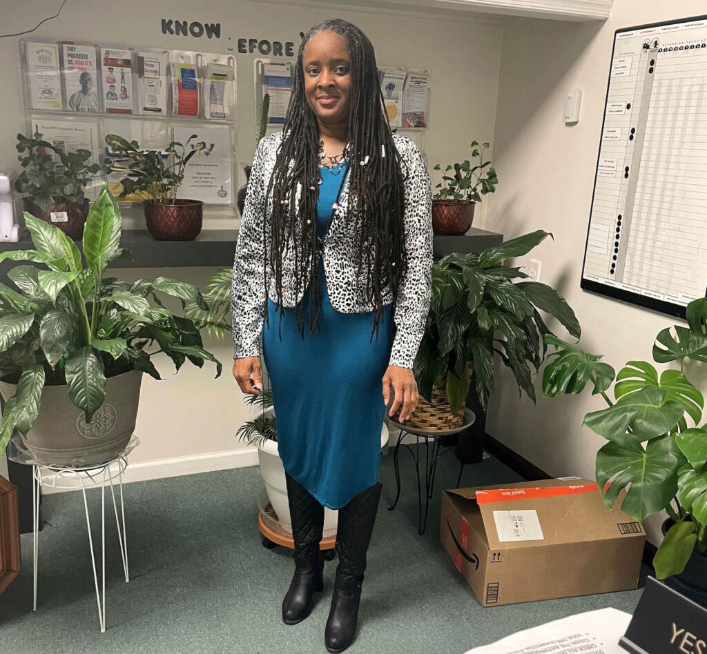 Sheila Berkel stands inside her office