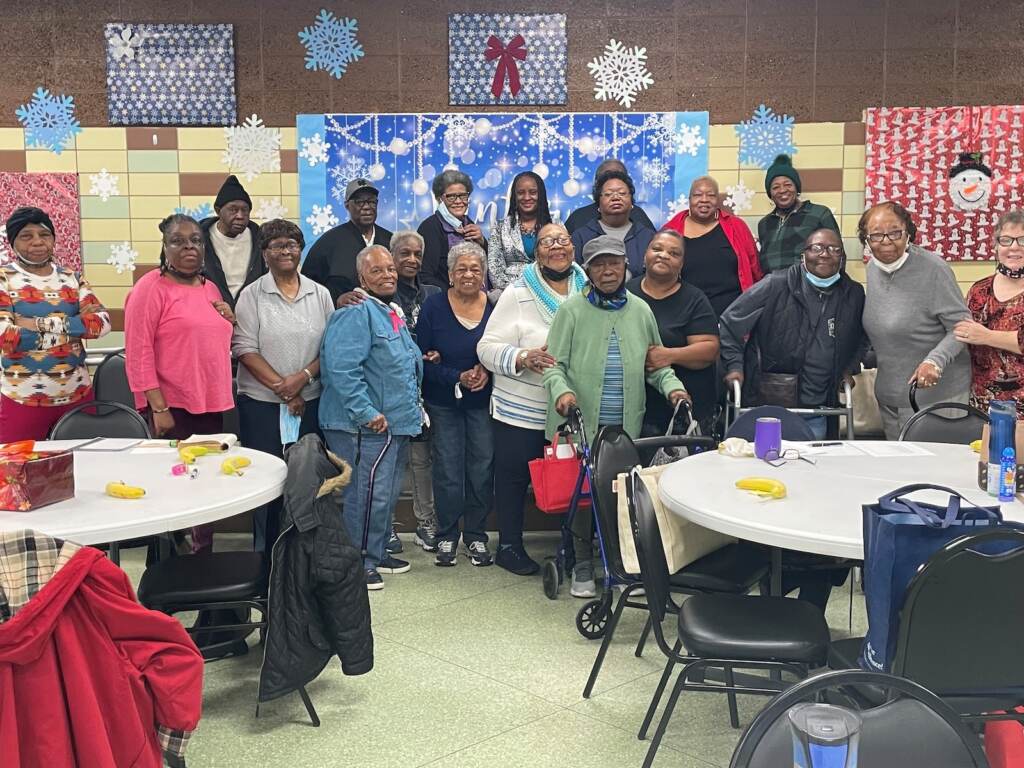 Sheila Berkel with members of the agency's De La Warr Senior Center