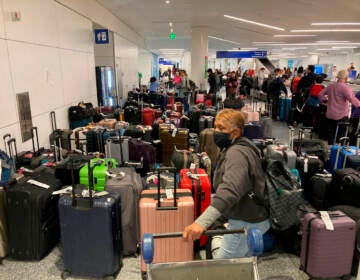 Baggage waits to be claimed after canceled flights at the Southwest Airlines terminal at Los Angeles International Airport