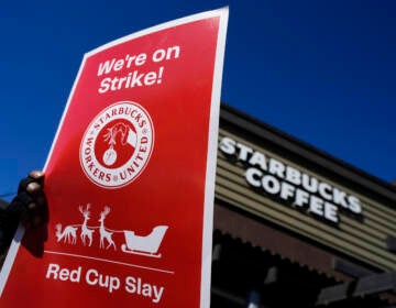 FILE - Starbucks employees strike outside their store in Mesa, Ariz., Nov. 17, 2022. Starbucks workers around the U.S. are planning a three-day strike starting Friday, Dec. 16, as part of their effort to unionize the coffee chain's stores. (AP Photo/Matt York, File)