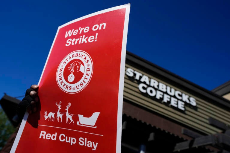 FILE - Starbucks employees strike outside their store in Mesa, Ariz., Nov. 17, 2022. Starbucks workers around the U.S. are planning a three-day strike starting Friday, Dec. 16, as part of their effort to unionize the coffee chain's stores. (AP Photo/Matt York, File)