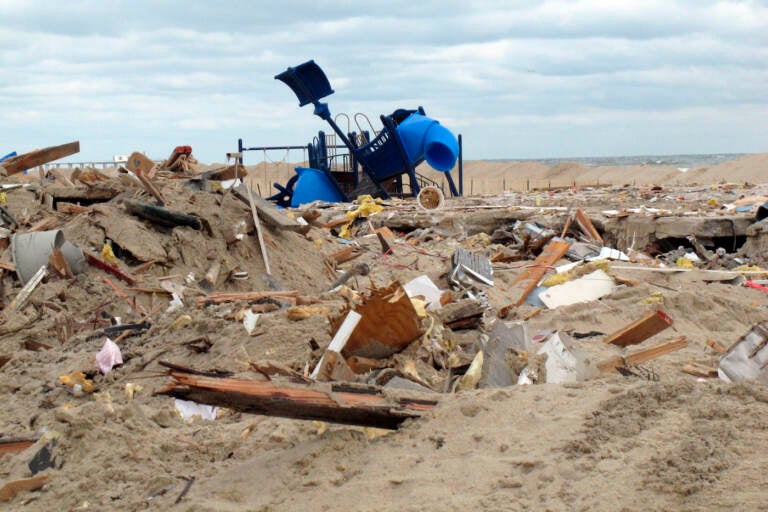 FILE - Debris is seen where the boardwalk used to stand in Belmar N.J., Nov. 15, 2012, two weeks after Superstorm Sandy pummeled the New Jersey shore. The U.S. Army Corps of Engineers is taking questions from the public on a massive $52 billion storm protection project it has proposed to prevent the type of catastrophic damage caused by Sandy during future storms. (AP Photo/Wayne Parry, File)