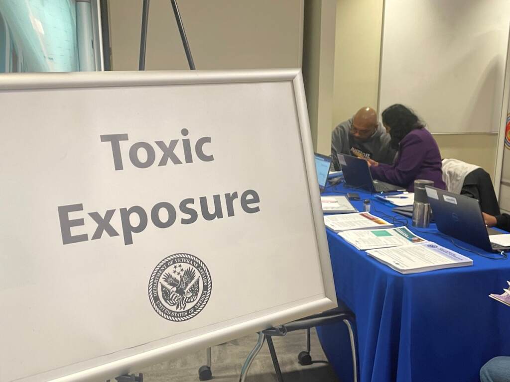 A sign reads "Toxic Exposure."
