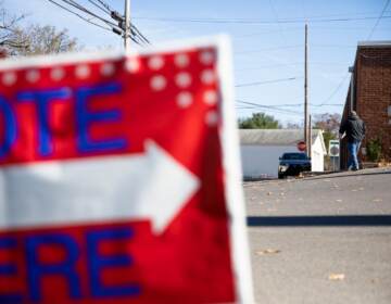 A sign outside a polling place reads, ''Vote here''