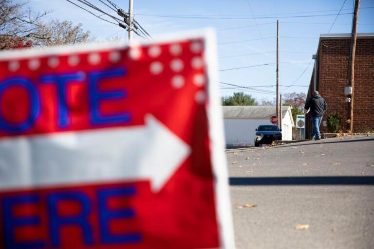 A sign outside a polling place reads, ''Vote here''