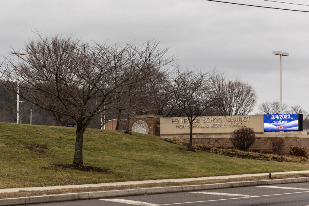 A sign that reads "Pennridge School Distric" is visible on a grassy lawn.