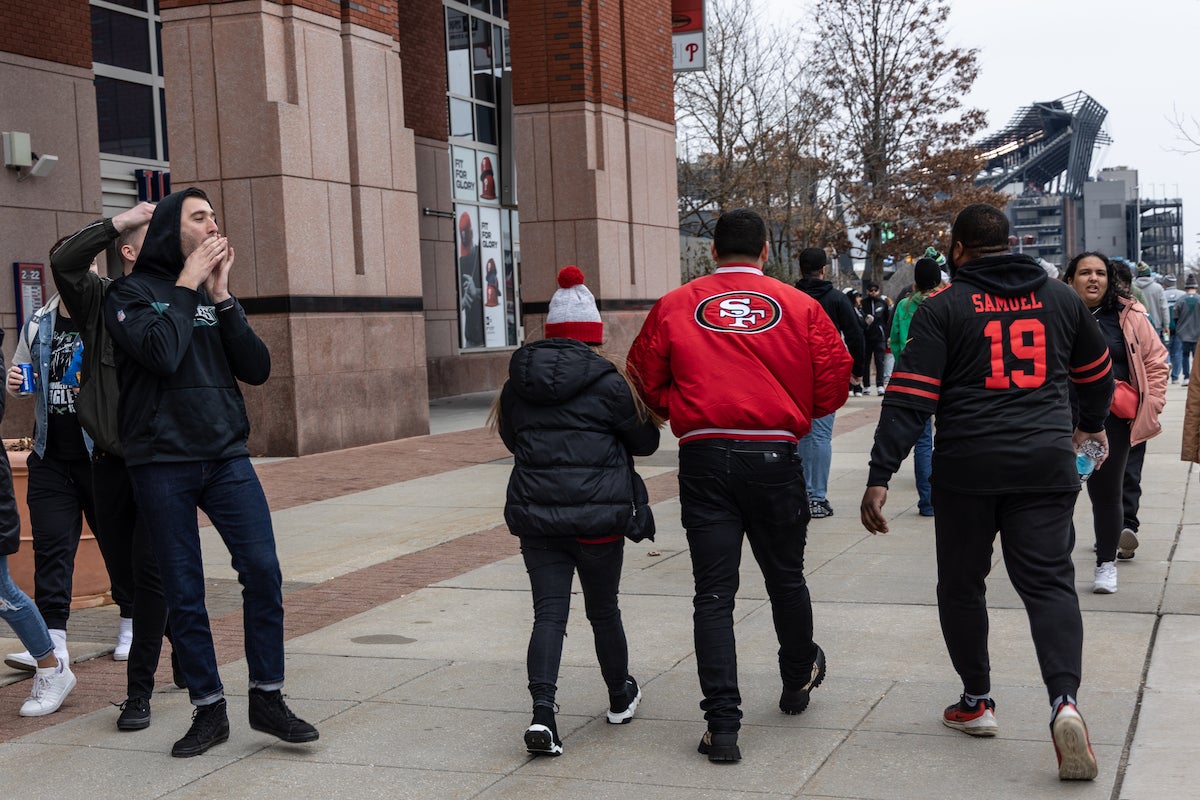 Eagles fans boo 49ers fans on their way into the NFC East Championship game in Philadelphia on January 29, 2023. (Kimberly Paynter/WHYY)