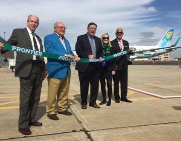 County officials including County Executive Brian Hughes, at a ribbon cutting to welcome Frontier Airlines to Trenton-Mercer Airport in 2017