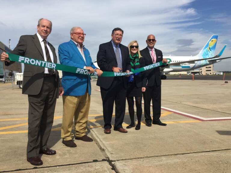 County officials including County Executive Brian Hughes, at a ribbon cutting to welcome Frontier Airlines to Trenton-Mercer Airport in 2017