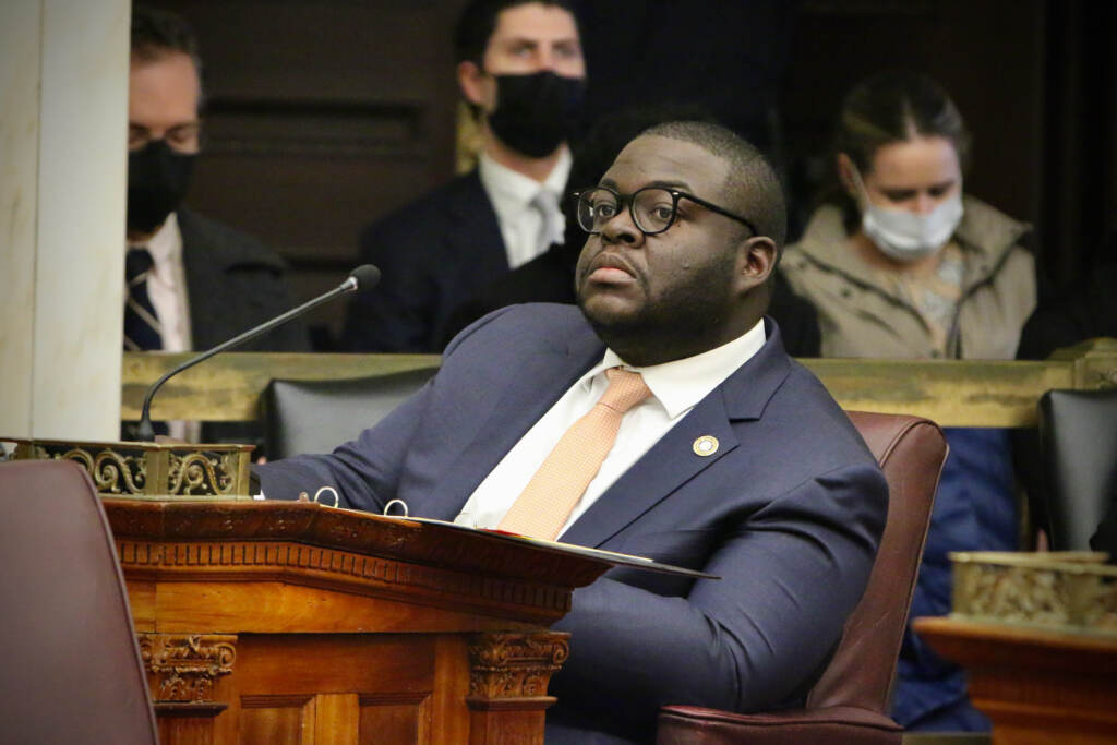 City Councilmember Anthony Phillips sits at his desk in City Hall council chambers.