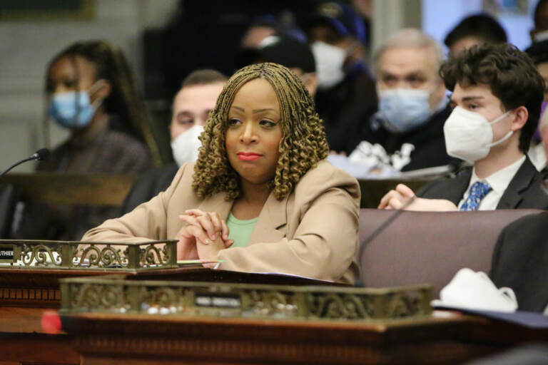 Philadelphia City Councilmember Jamie Gauthier is seated at her council desk.