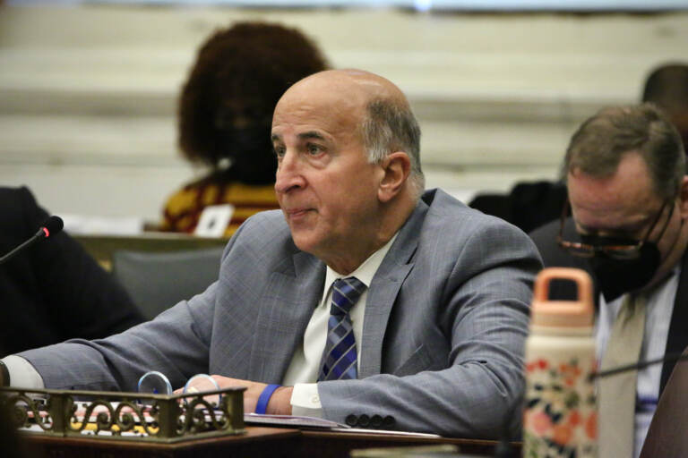 Councilmember Mark Squilla sits at a desk in council chambers.