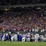 The Buffalo Bills players pray for teammate Damar Hamlin during the first half of an NFL football game against the Cincinnati Bengals, Monday, Jan. 2, 2023, in Cincinnati. (AP Photo/Jeff Dean)
