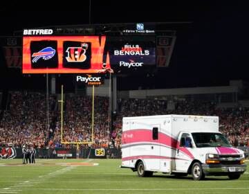 An ambulance leaves the field with Buffalo Bills' Damar Hamlin during the first half of an NFL football game between the Bills and the Cincinnati Bengals, Monday, Jan. 2, 2023, in Cincinnati