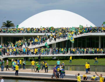 Protesters, supporters of Brazil's former President Jair Bolsonaro, storm the the National Congress building in Brasilia, Brazil, Sunday, Jan. 8, 2023