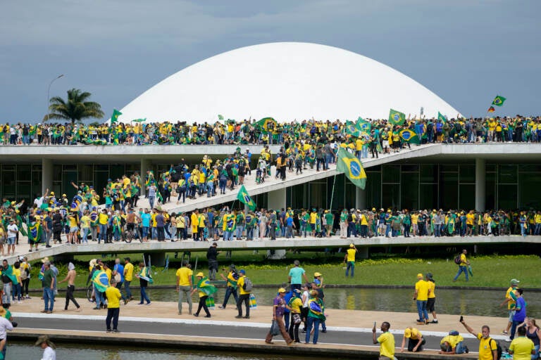 Protesters, supporters of Brazil's former President Jair Bolsonaro, storm the the National Congress building in Brasilia, Brazil, Sunday, Jan. 8, 2023