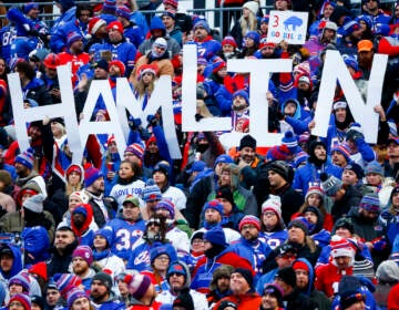 Fans hold a sign in support of Buffalo Bills safety Damar Hamlin during the second half of an NFL football game against the New England Patriots, Sunday, Jan. 8, 2023, in Orchard Park.