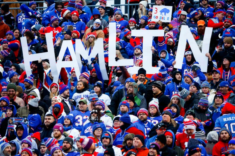 Fans hold a sign in support of Buffalo Bills safety Damar Hamlin during the second half of an NFL football game against the New England Patriots, Sunday, Jan. 8, 2023, in Orchard Park.