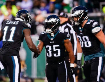 Philadelphia Eagles running back Boston Scott (35) celebrates his touchdown run with wide receiver A.J. Brown (11) and tight end Dallas Goedert (88) during the first half of an NFL football game against the New York Giants, Sunday, Jan. 8, 2023, in Philadelphia