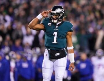 Philadelphia Eagles quarterback Jalen Hurts reacts after throwing a touchdown pass to wide receiver DeVonta Smith