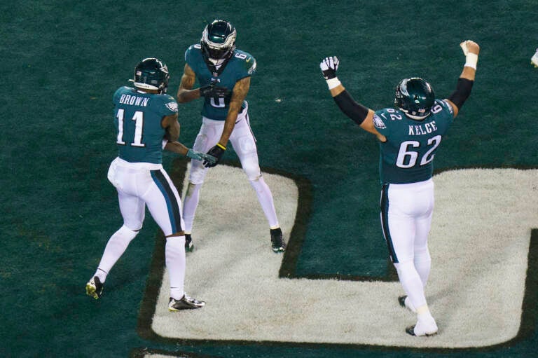 Philadelphia Eagles wide receiver DeVonta Smith (6) celebrates his touchdown with wide receiver A.J. Brown (11) and center Jason Kelce (62)